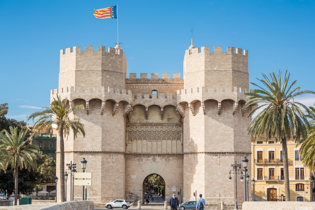 Torres de Serranos city gate with the flag of the Comunitat Valenciana